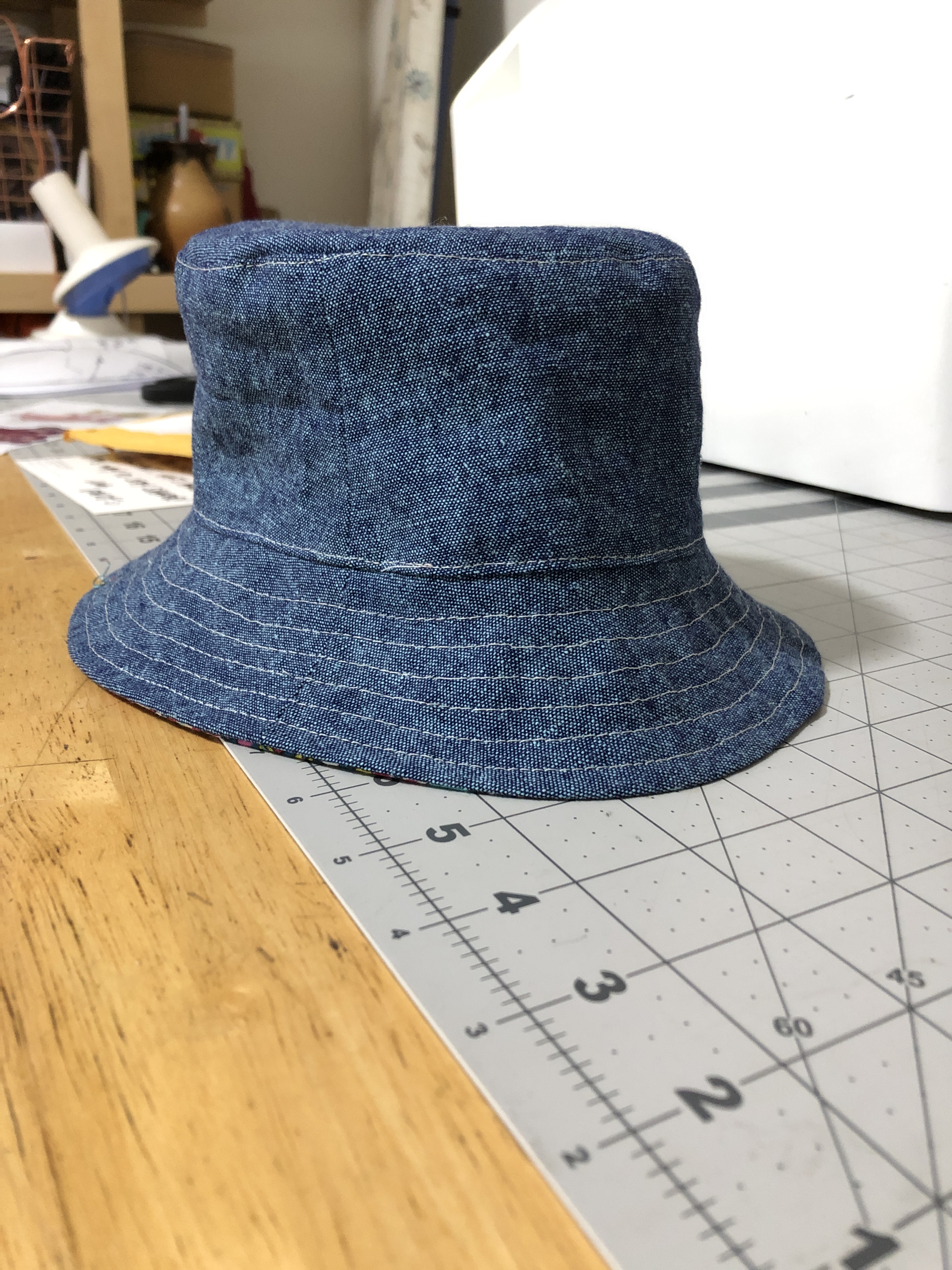 a blue linen/chambray baby-sized bucket hat