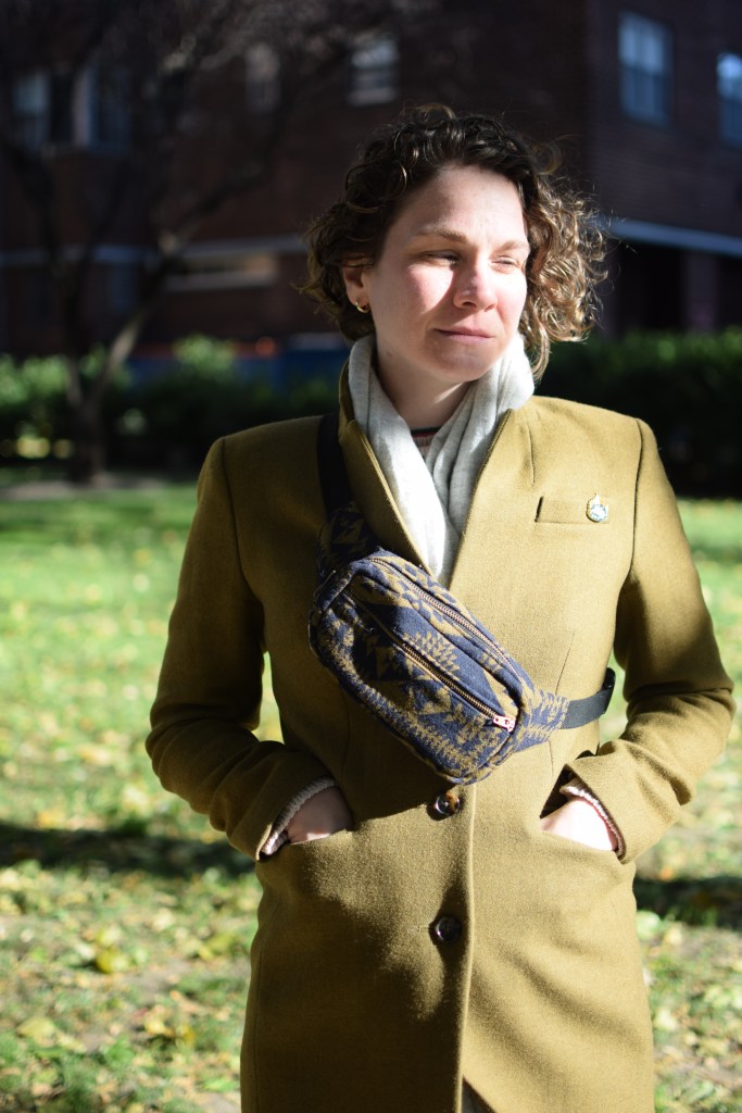 a woman models a handmade fanny pack.