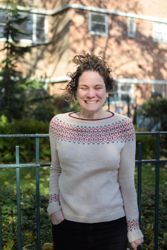 a woman is jumping because of how cold she is.