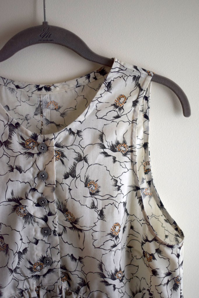 Closeup of a handmade black and white floral dress.
