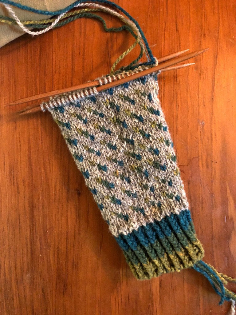 an in-progress photo of a hand knitted, allover colorwork sweater