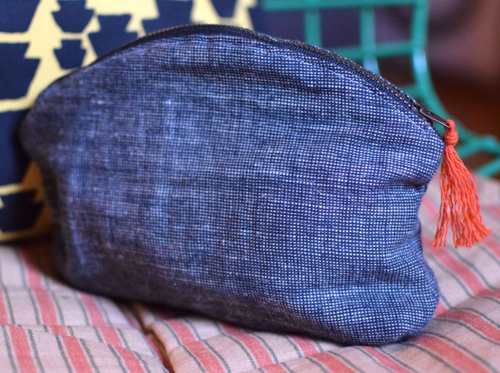 a black and white zipper pouch.